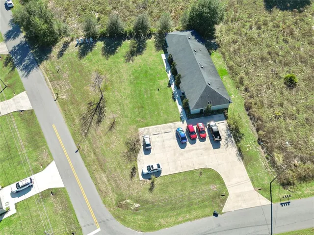 an aerial view of a house with swimming pool