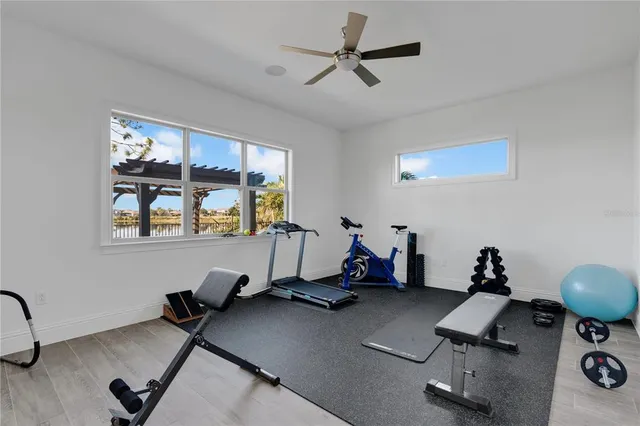 a bedroom with bed and flat screen tv