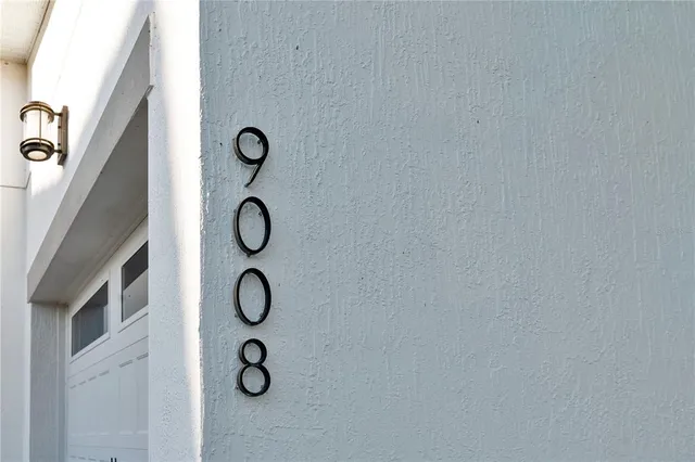 a view of a hallway with wooden floor and entryway