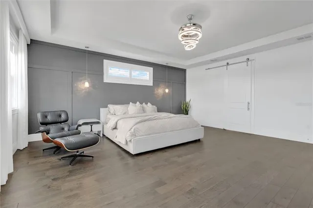 a spacious bathroom with a double vanity sink mirror and bathtub