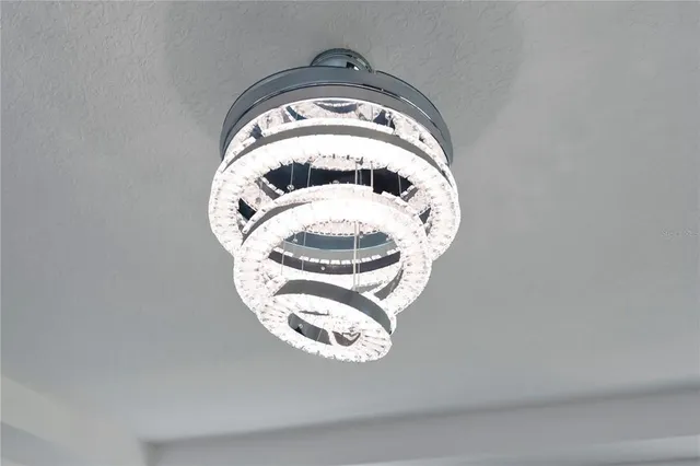 a living room with furniture and view of kitchen