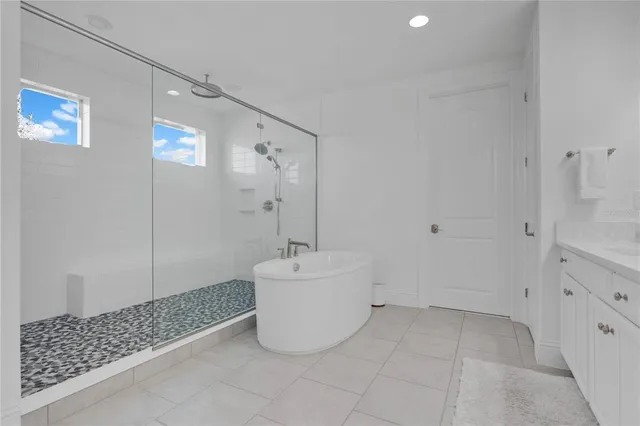 a view of a workspace with wooden floor and a window