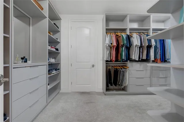 a view of a patio with a table and chairs
