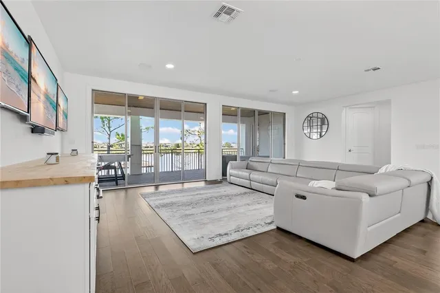a view of a patio with a table and chairs next to a yard
