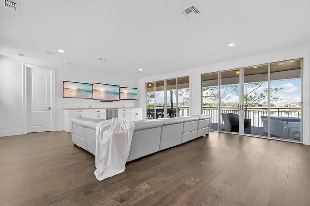 an aerial view of a house with a swimming pool and outdoor space