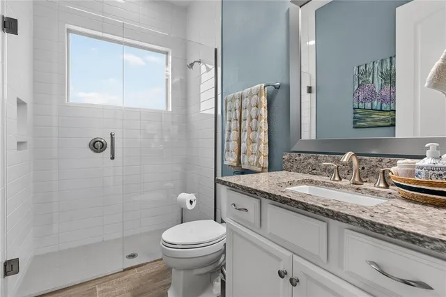 a large kitchen with a table and chairs