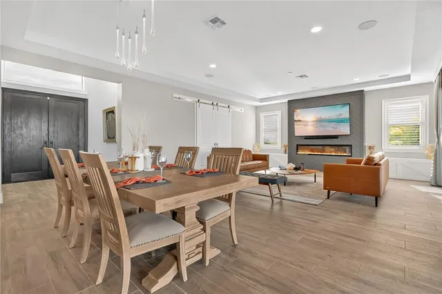 a living room with furniture window and wooden floor