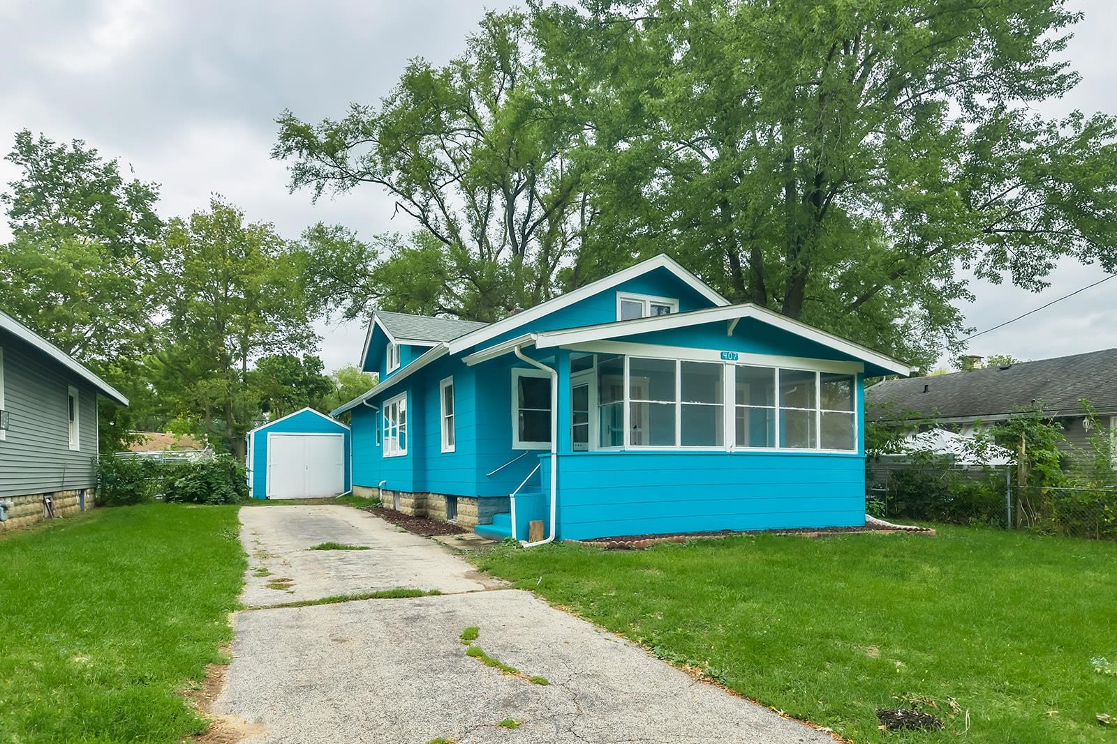 407 Barnum Road Rockford, IL 61109 - Photo 1 of 26 a front view of a house with a yard