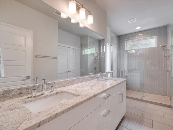 a bathroom with a sink toilet and a mirror