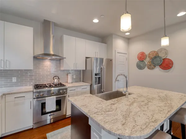 a kitchen with a table and chairs in it