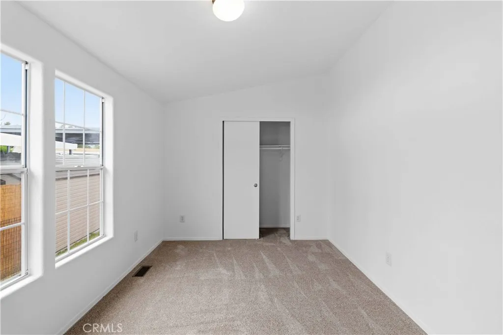 1550 Rory Simi Valley, Unit 133 Simi Valley, CA 93063 - Photo 19 of 29 a view of empty room with windows