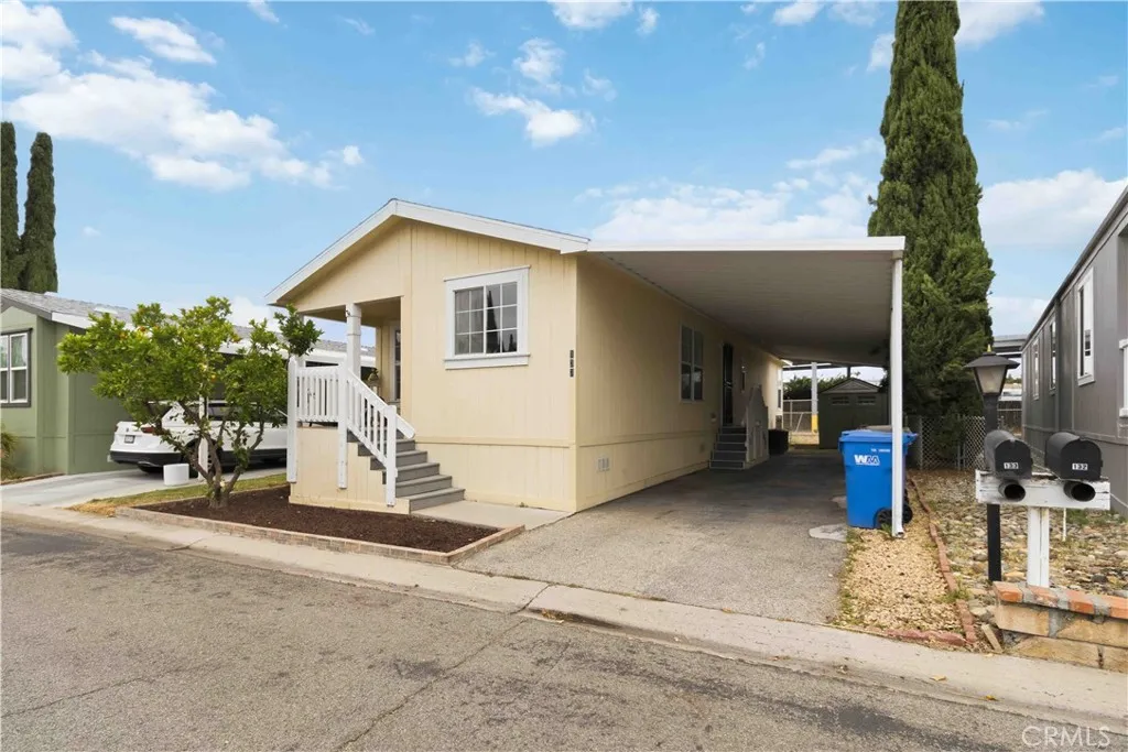 1550 Rory Simi Valley, Unit 133 Simi Valley, CA 93063 - Photo 2 of 29 a view of a house with a patio and a yard