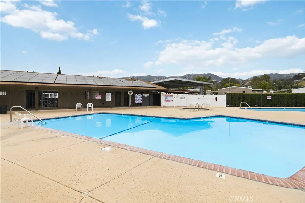 1550 Rory Simi Valley, Unit 133 Simi Valley, CA 93063 - Photo 27 of 29 a view of a house with a swimming pool