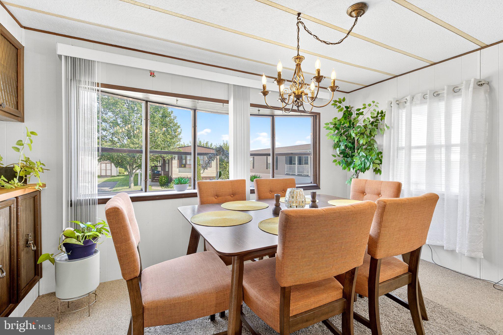 77 Ridgewood Manor Manheim, PA 17545 - Photo 14 of 36 a view of a dining room with furniture window and outside view