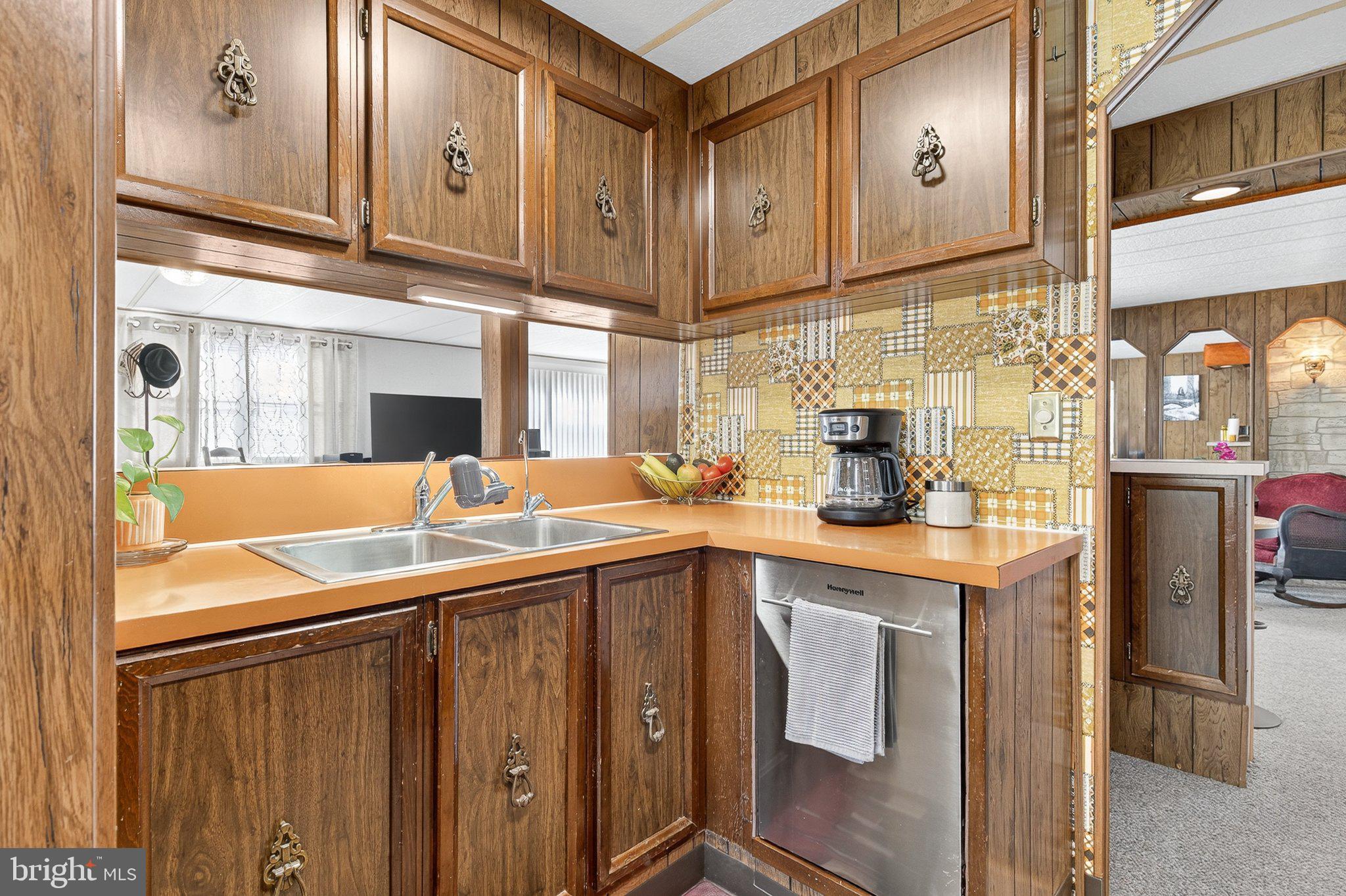 77 Ridgewood Manor Manheim, PA 17545 - Photo 17 of 36 a kitchen with stainless steel appliances granite countertop a sink a stove and cabinets