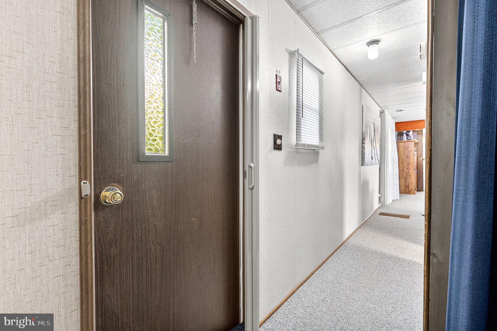 77 Ridgewood Manor Manheim, PA 17545 - Photo 20 of 36 a view of a hallway with windows and entryway