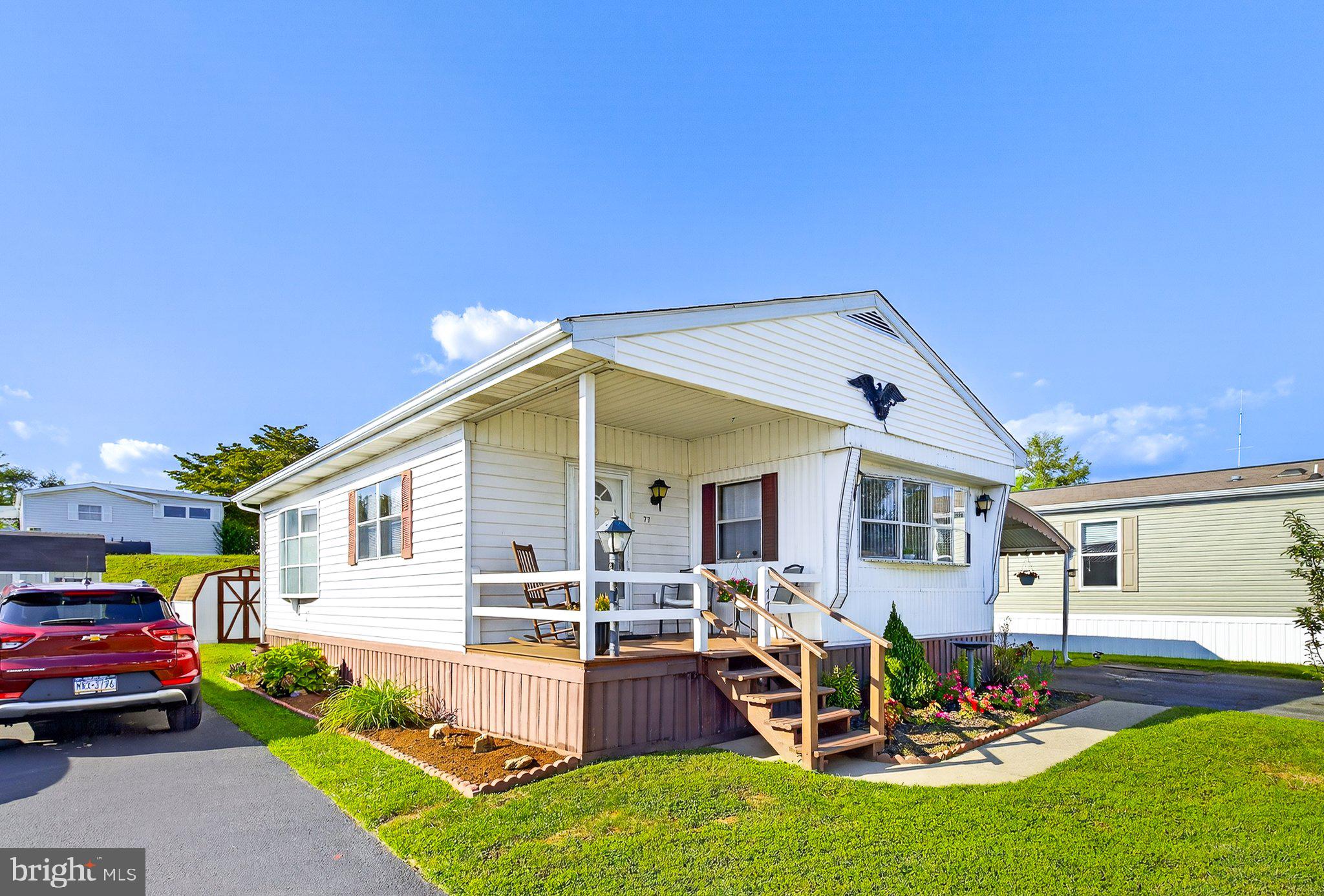 77 Ridgewood Manor Manheim, PA 17545 - Photo 2 of 36 a view of a house with backyard swimming pool and sitting area
