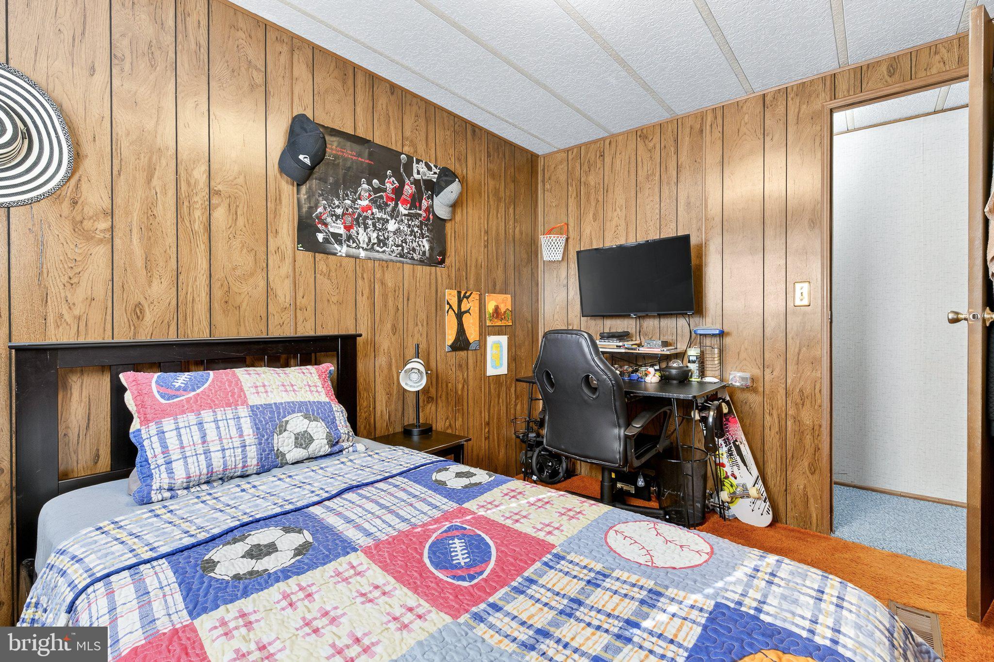 77 Ridgewood Manor Manheim, PA 17545 - Photo 24 of 36 a bedroom with a bed and a flat screen tv