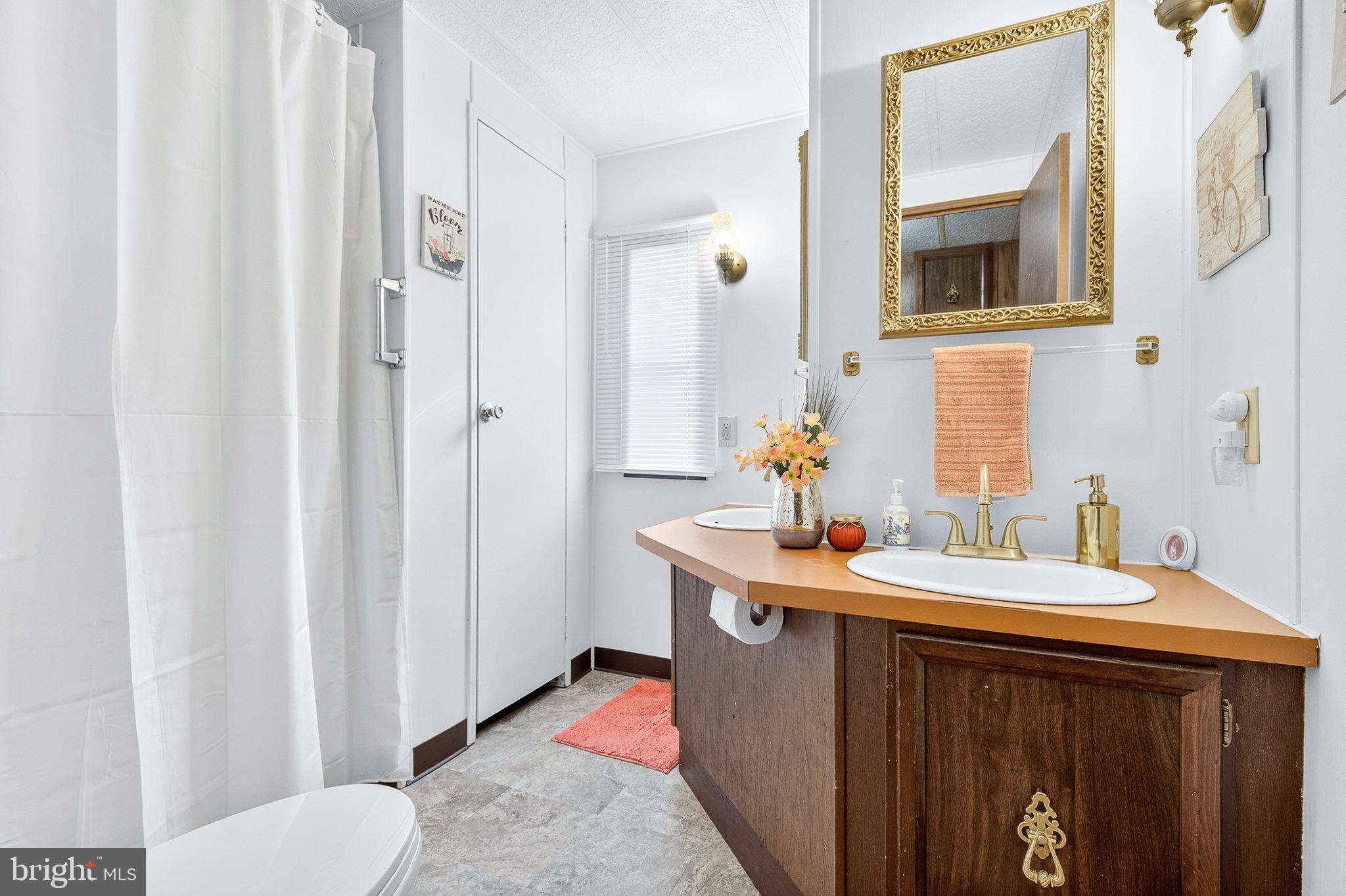 77 Ridgewood Manor Manheim, PA 17545 - Photo 25 of 36 a bathroom with a sink and a mirror