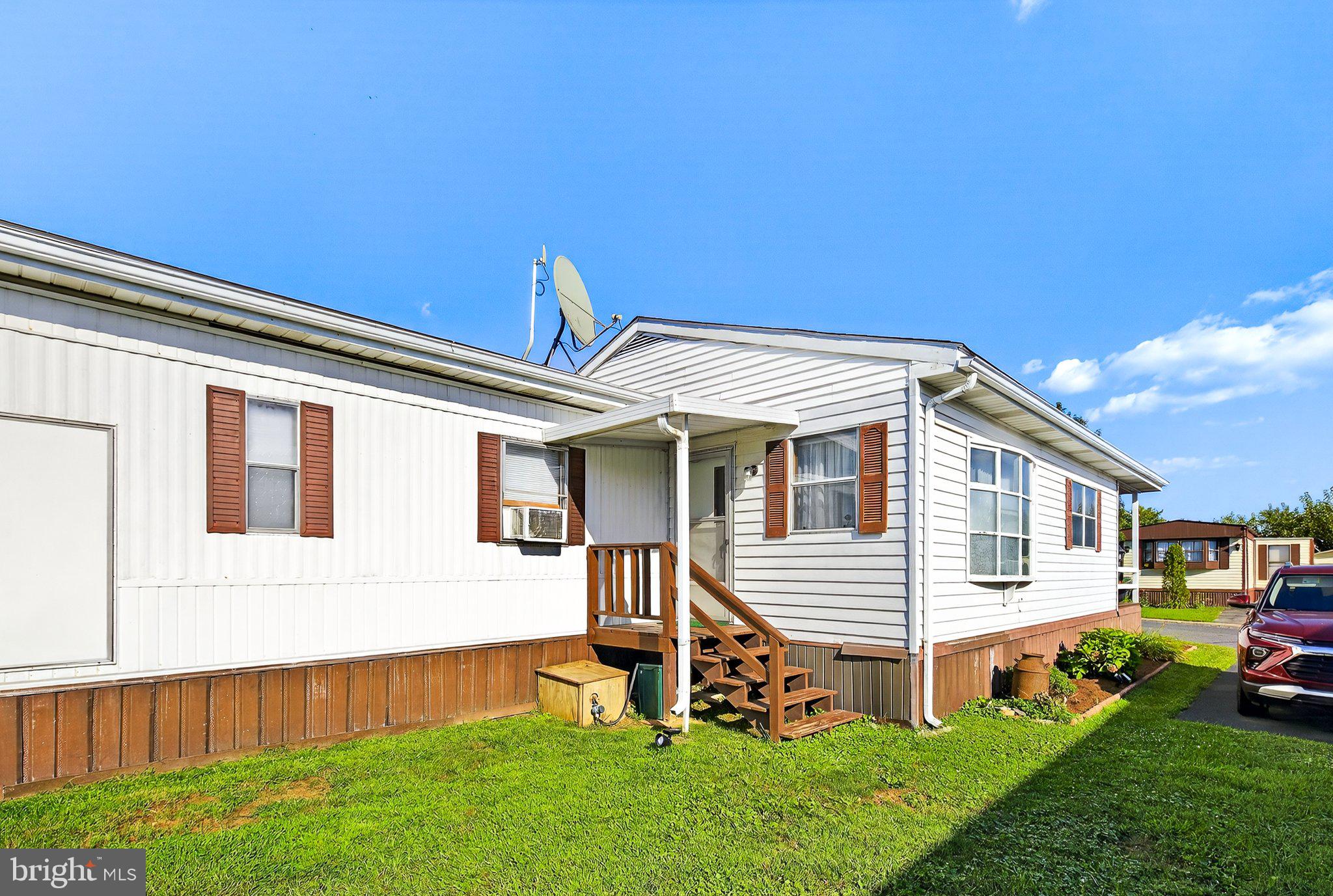 77 Ridgewood Manor Manheim, PA 17545 - Photo 27 of 36 a front view of a house with a yard