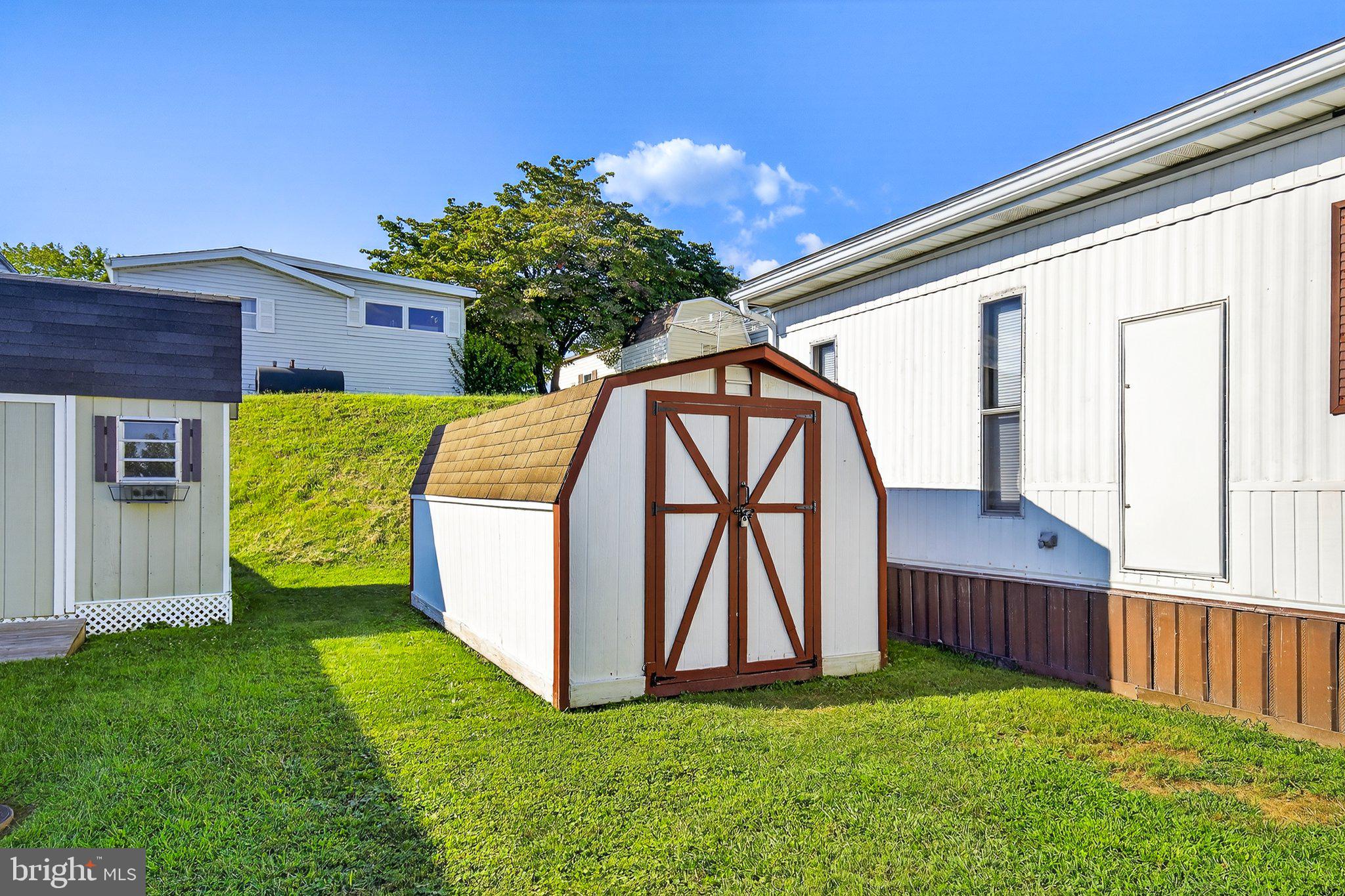 77 Ridgewood Manor Manheim, PA 17545 - Photo 29 of 36 a view of backyard with a tub and wooden fence