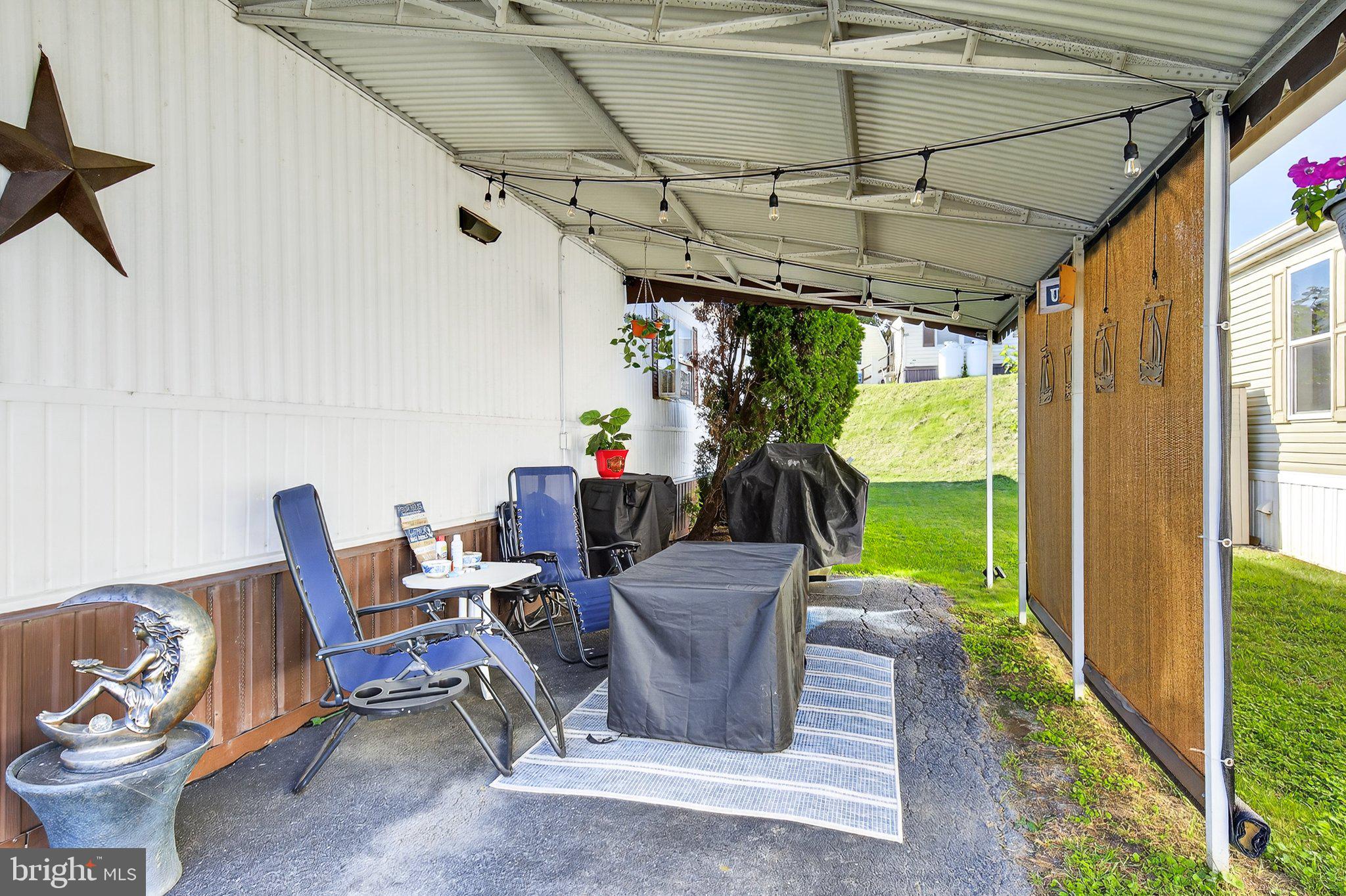 77 Ridgewood Manor Manheim, PA 17545 - Photo 4 of 36 a view of a chairs and table in a patio