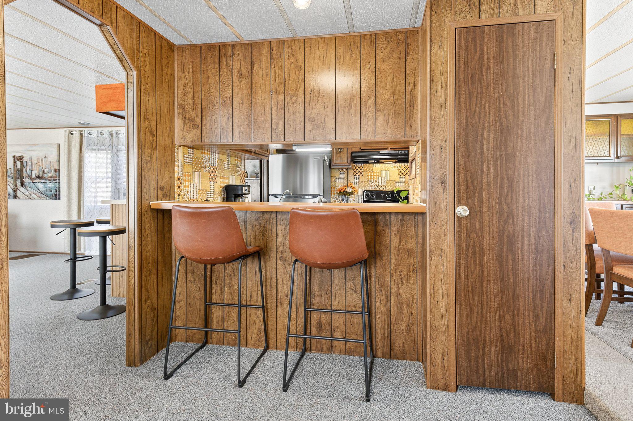 77 Ridgewood Manor Manheim, PA 17545 - Photo 7 of 36 a kitchen with appliances cabinets and chair