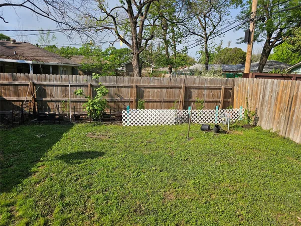 a front view of a house with a yard table and chairs