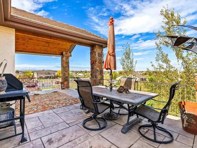 a view of a terrace with furniture and a table