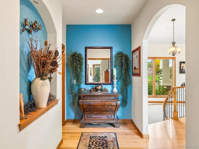 a room with furniture and a potted plant