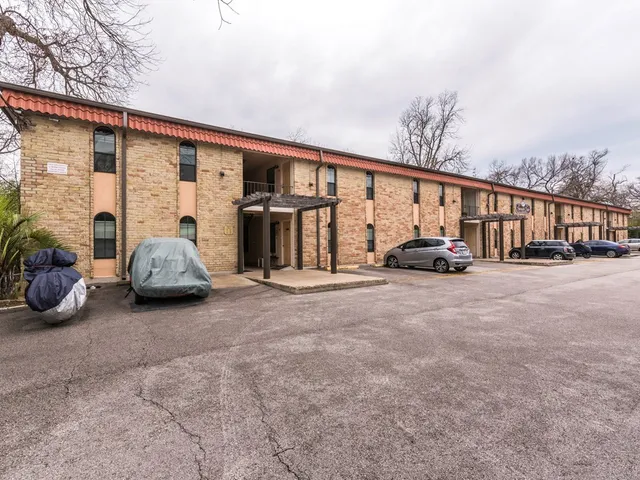 a view of car parked in front of house