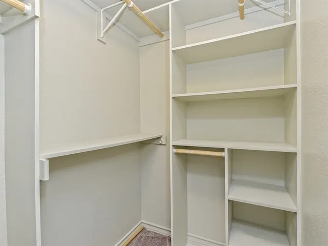 a view of an empty walk in closet