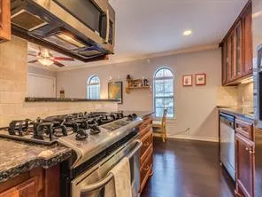a kitchen with a stove and a refrigerator