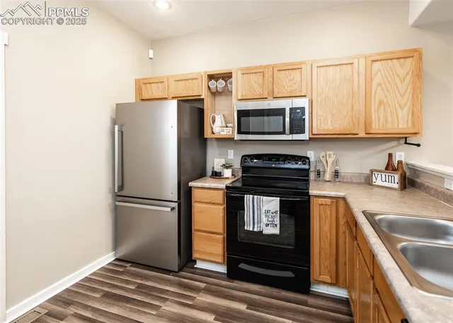 a kitchen with a refrigerator stove and microwave