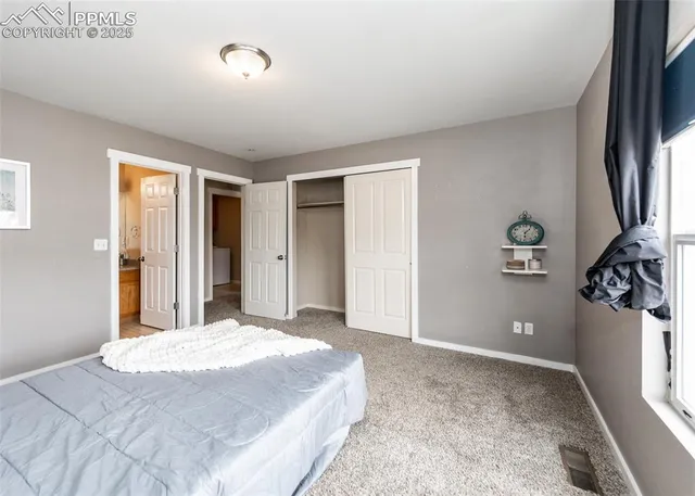 a bathroom with a toilet a sink and a mirror