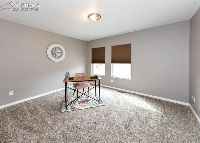 a view of a livingroom with furniture and window
