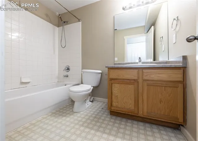 a bathroom with a toilet and a bathtub