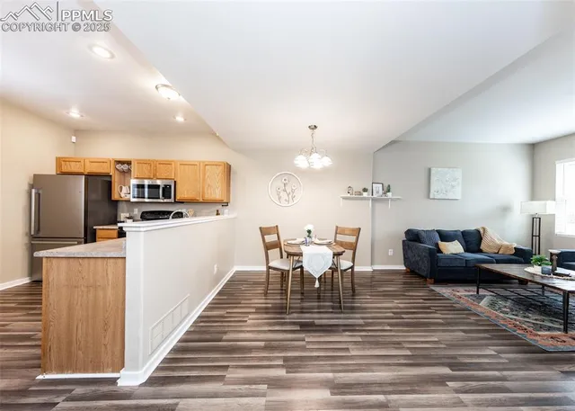 a view of a dining room with furniture and wooden floor