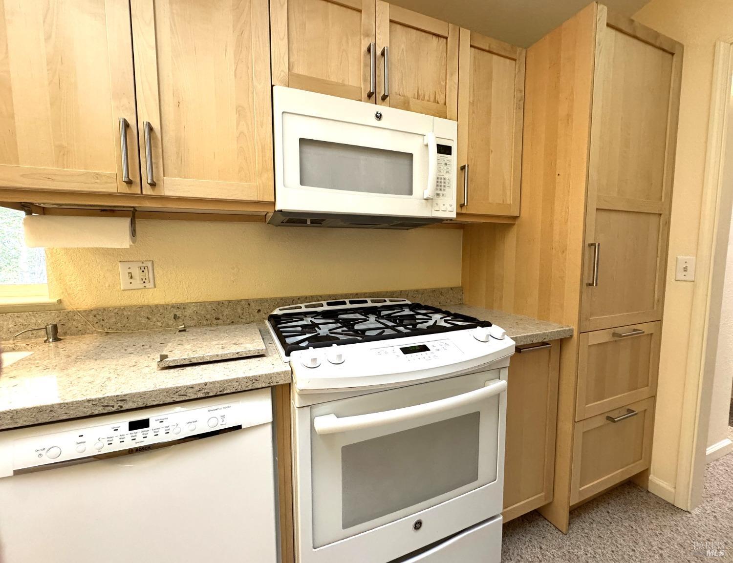 43300 Little River-Airport Road, Unit 35 Little River, CA 95456 - Photo 12 of 23 a stove top oven sitting inside of a kitchen