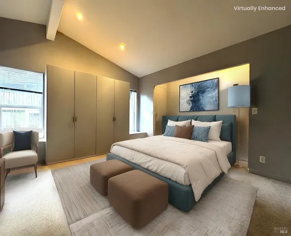 a bedroom with bed and a couch