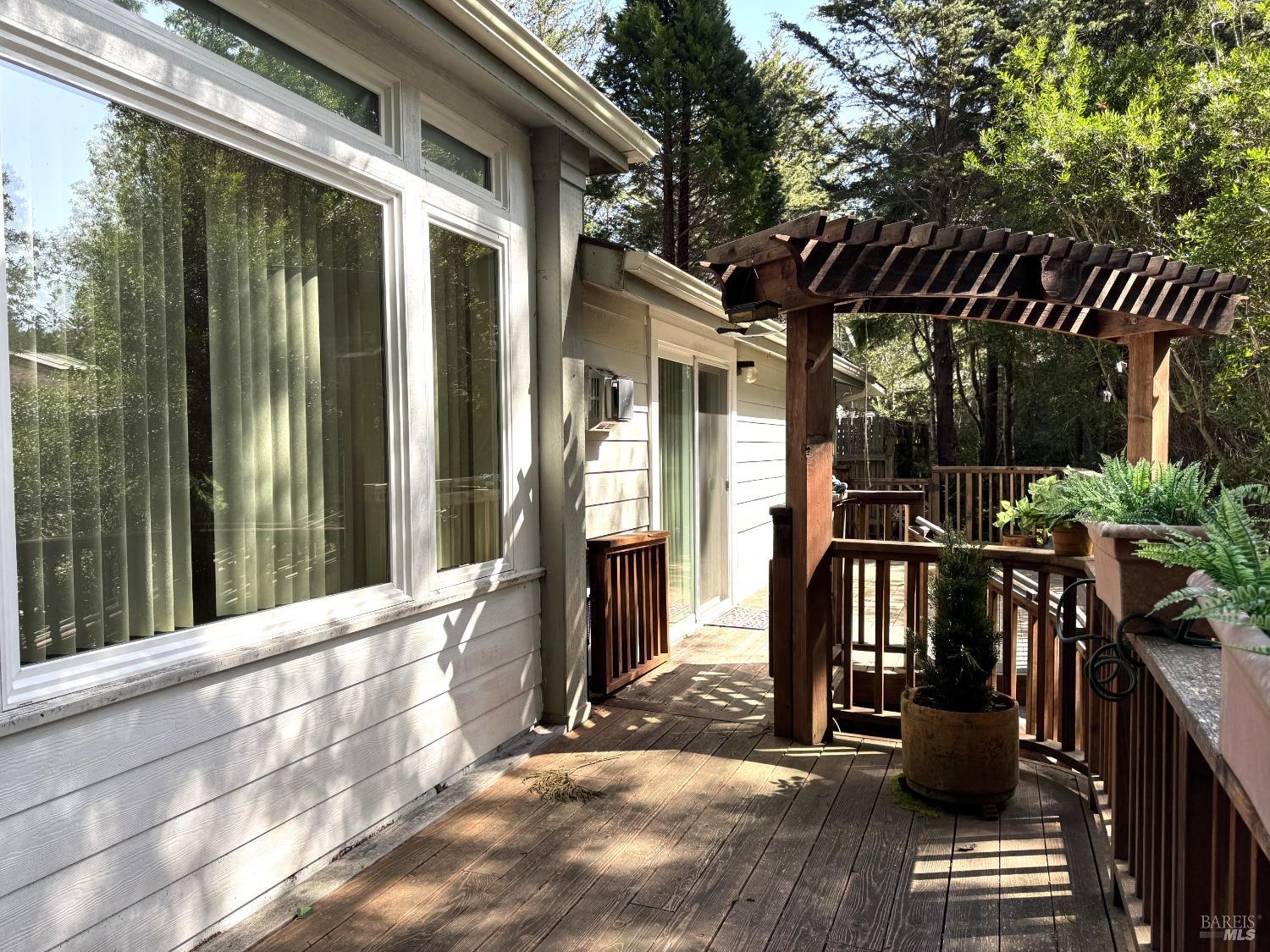 43300 Little River-Airport Road, Unit 35 Little River, CA 95456 - Photo 2 of 23 a view of porch with furniture and floor to ceiling window