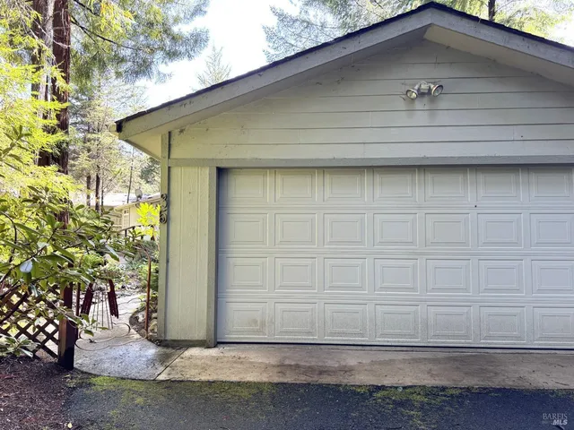 a side view of a house with a yard