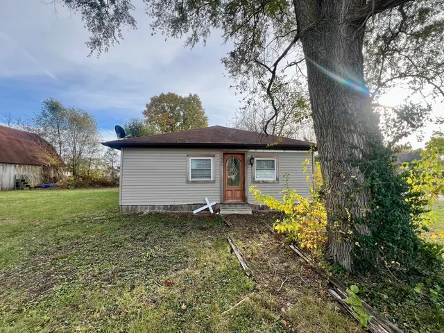 a view of a house with a garden