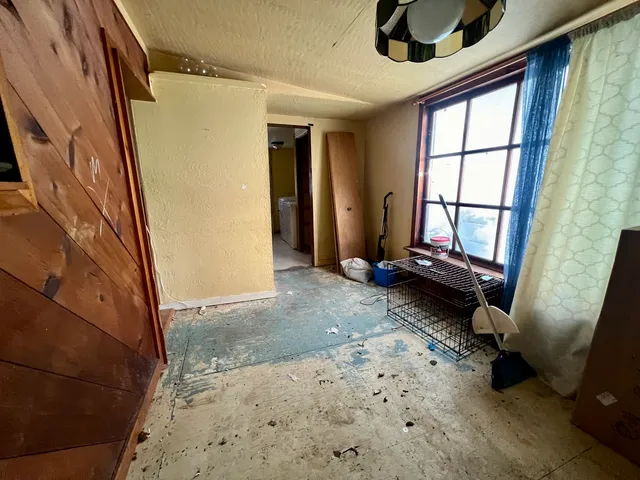 a view of a hallway with windows