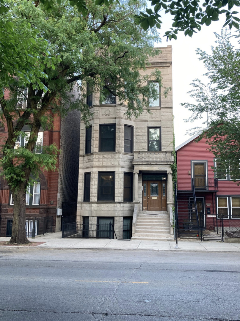 1109 South Racine Avenue Chicago, IL 60607 - Photo 1 of 29 a front view of a house with a garage