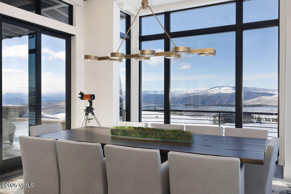 92 Pine Marten Way Edwards, CO 81632 - Photo 11 of 54 a living room with couches and balcony with wooden floor