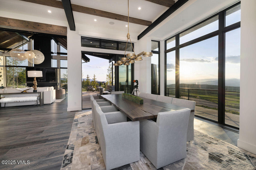 92 Pine Marten Way Edwards, CO 81632 - Photo 12 of 54 a dining room with furniture and wooden floor