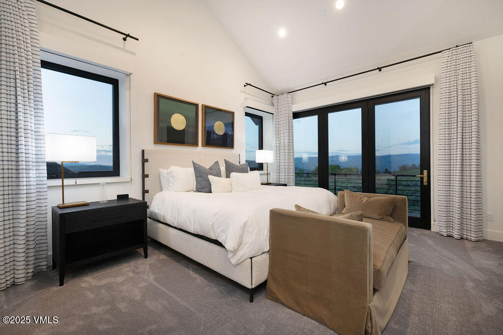 92 Pine Marten Way Edwards, CO 81632 - Photo 26 of 54 a bedroom with a bed and a large window