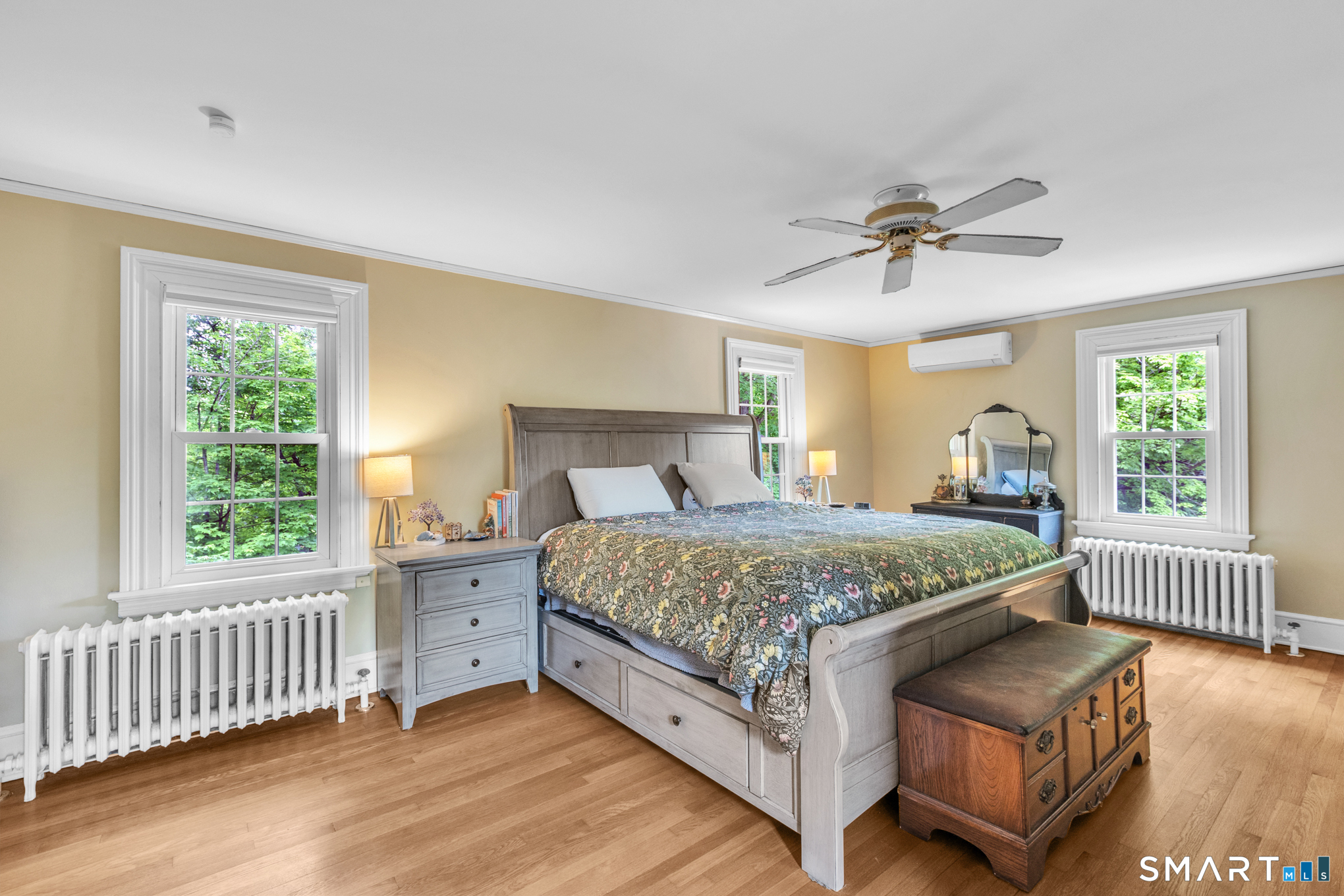 808 Branch Road Suffield, CT 06078 - Photo 20 of 40 a bedroom with a bed and a chandelier