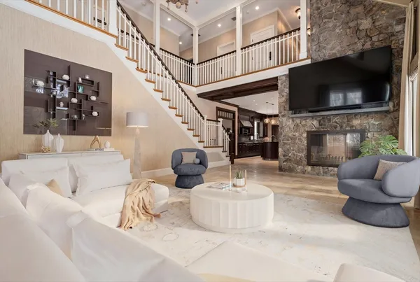 a living room with fireplace furniture and a flat screen tv